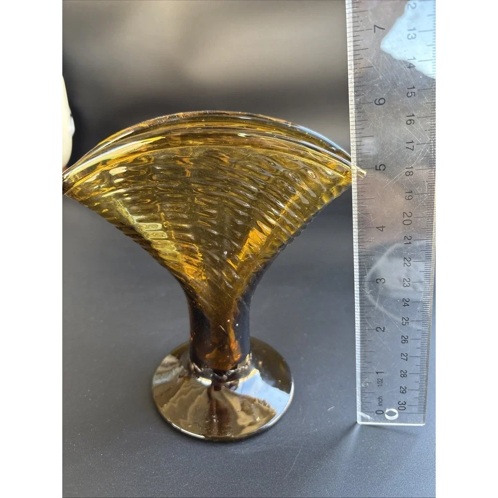 Mid-Century Modern Amber Glass Fan Vase featuring an optic ribbed pattern.